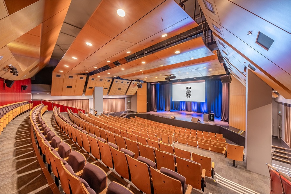 A large theatre viewing the stage from the auditorium on the right of the stage.