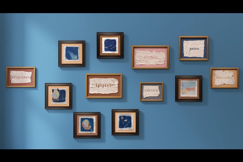 Twelve framed images on a blue wall.