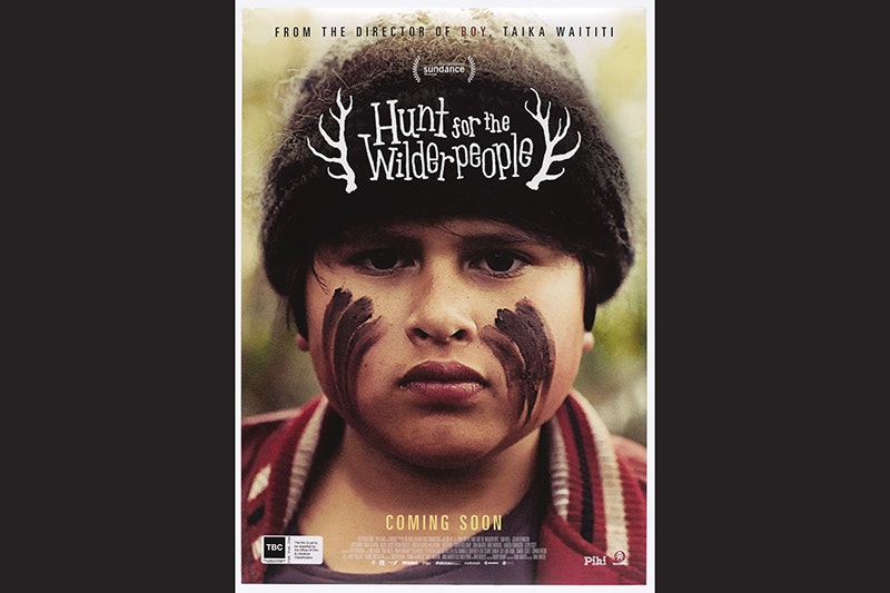 A film poster with the title and a close-up shot of Julian Denniston with markings on his face and a woolly hat.