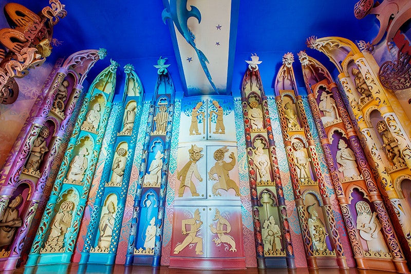 A colourful space with carved MDF panels and doors all different colours.